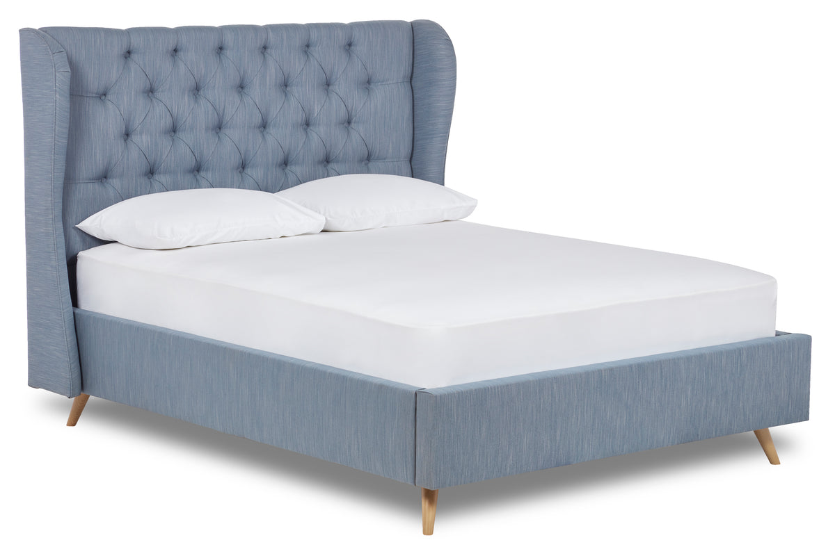 Baker Upholstered bed with winged headboard and beech wood legs