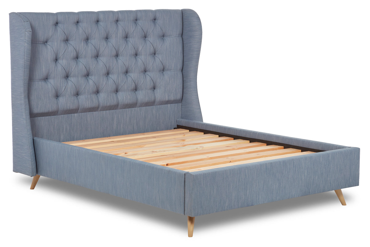 Baker Upholstered bed with winged headboard and beech wood legs
