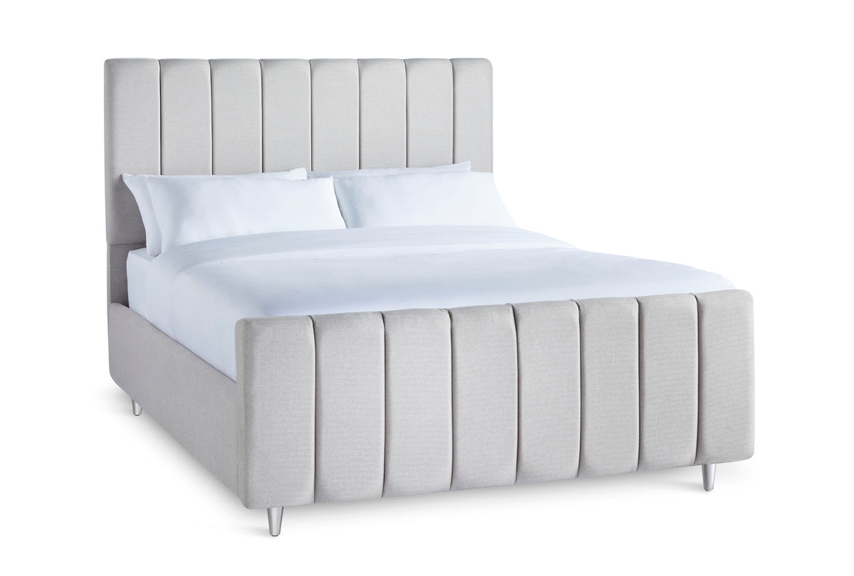 Shelley Upholstered bed with fluted headboard and high footboard
