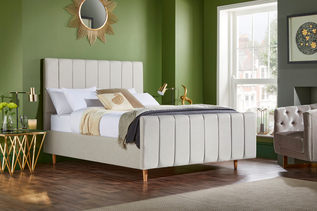 Shelley Upholstered bed with fluted headboard and high footboard
