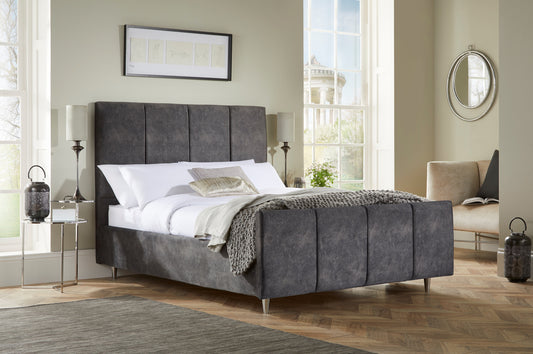 Chaplin Upholstered bed with fluted headboard and high footboard