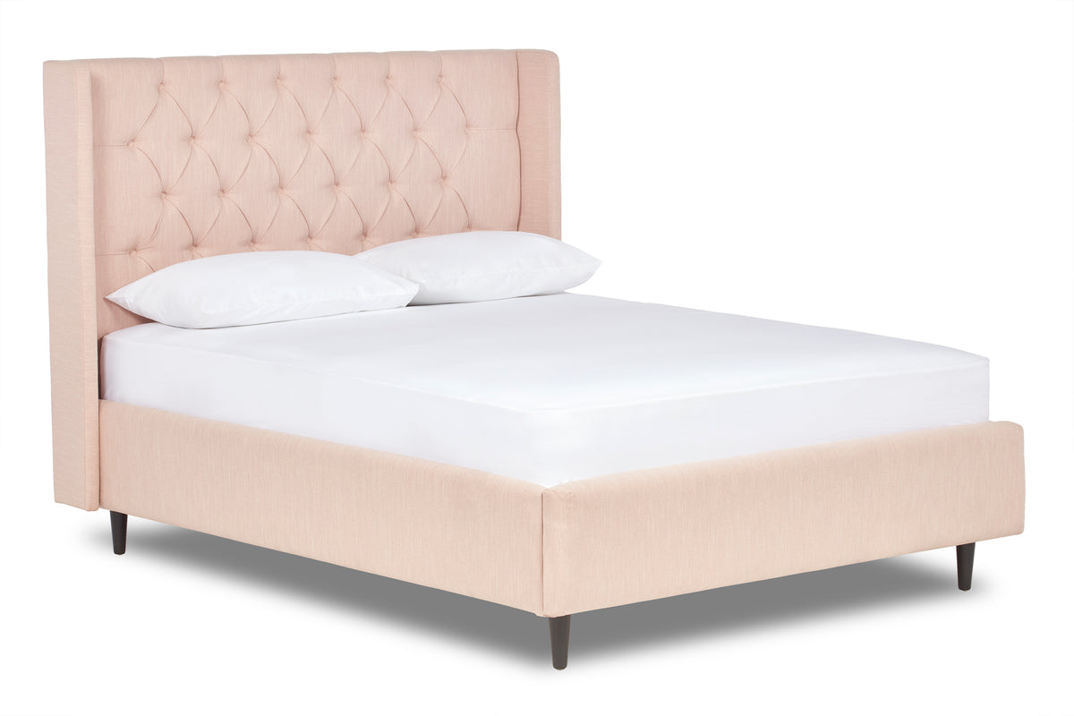 Jones Upholstered bed with Chesterfield-style winged headboard