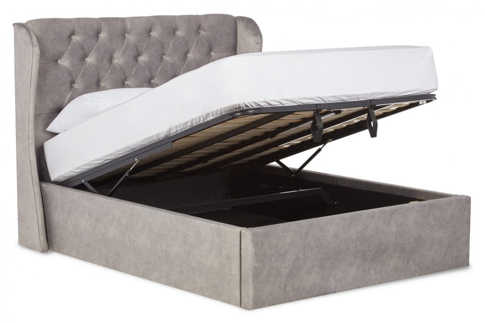Baker Upholstered ottoman bed with winged headboard