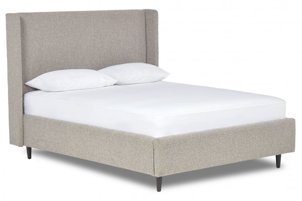 Nina Upholstered bed with winged headboard and legs